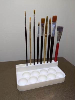 Paint palette with paintbrush organizer