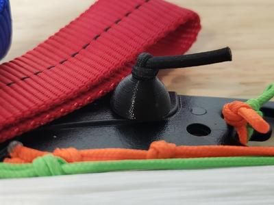 Kite line winder bungee ball and washer