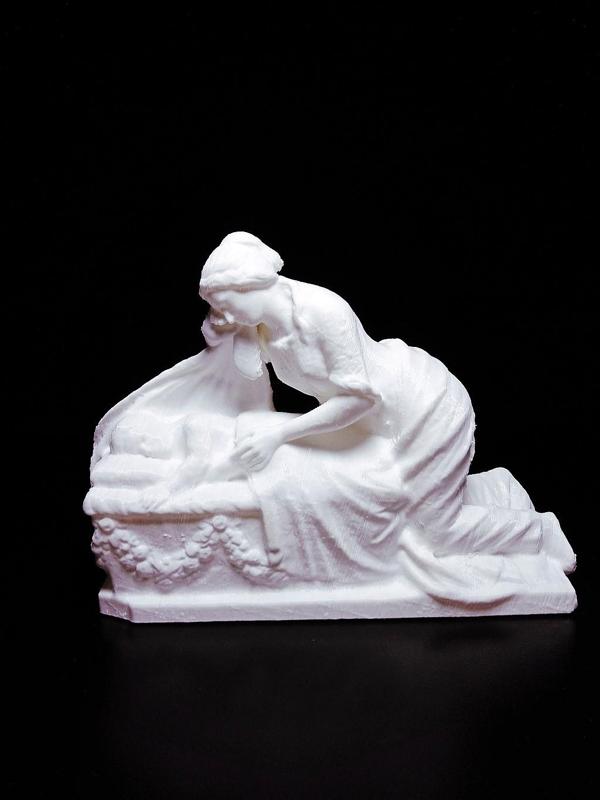 Gravestone Depicting Grieving Mother