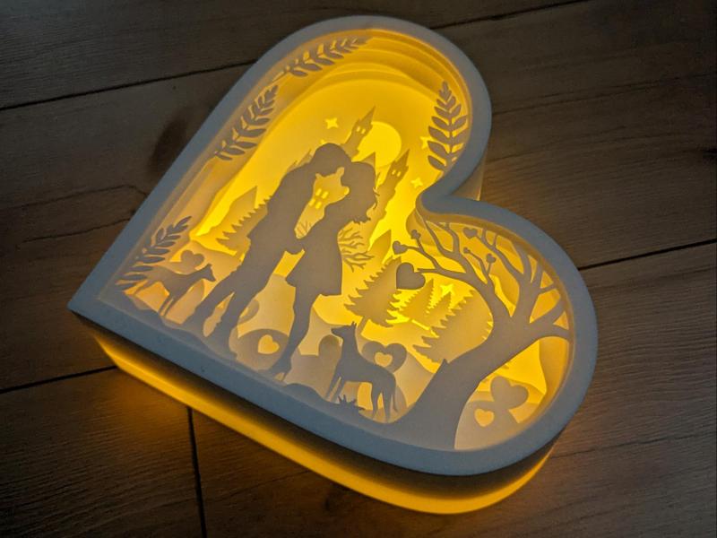 Pregnant woman with two dogs for shadow box