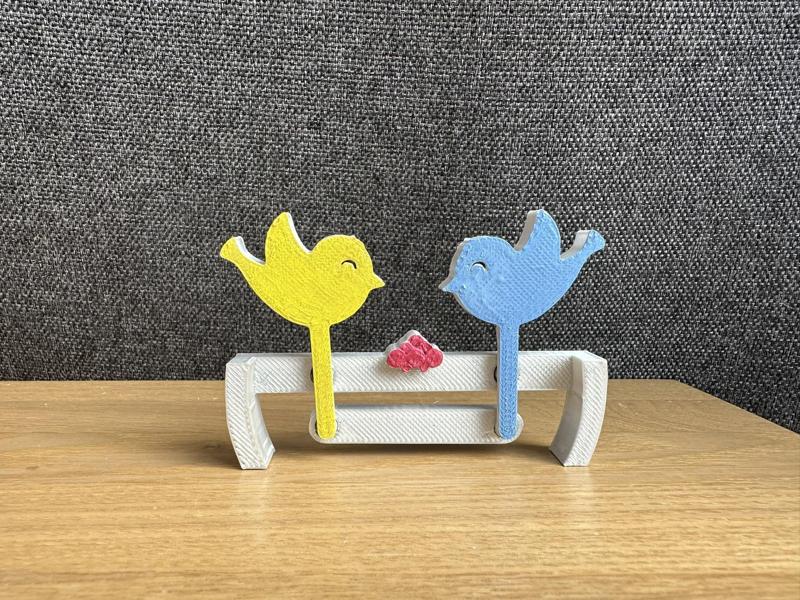 Birds peck grains toy
