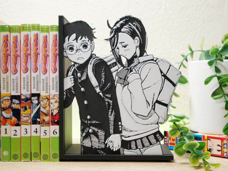 Bookend of Momo and Okarun holding hands 