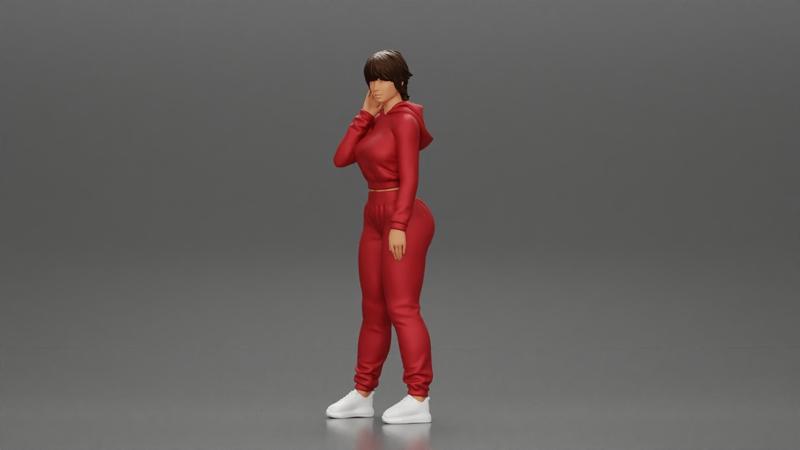 sexy girl in a sports outfit hoodie is standing