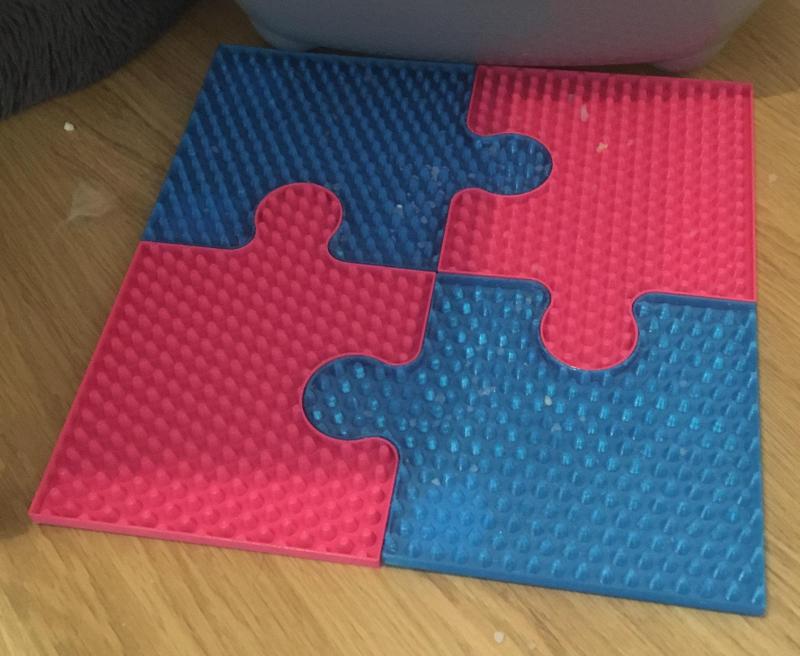 Puzzle-style cat rug