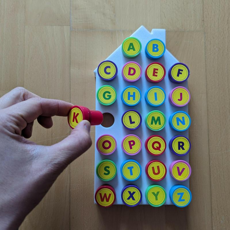 House stamp stand for 26 self-inking stamps