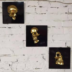 Triptych of human sculls