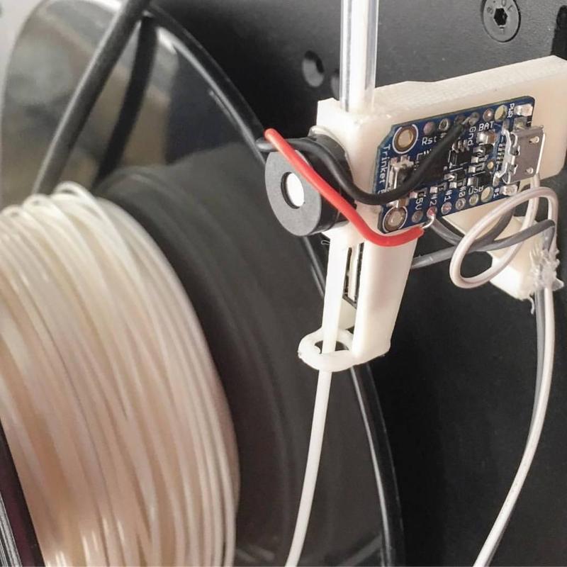 Filament tube holder with alarm