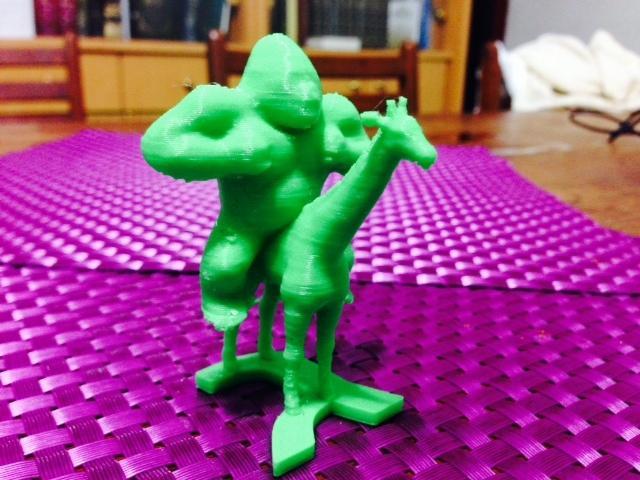 Gorilla riding a giraffe on the letter gimmel