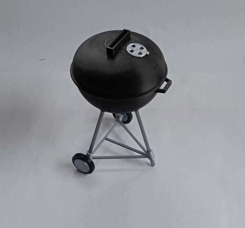 BBQ grill, like "WEBER" as a money box or tip jar