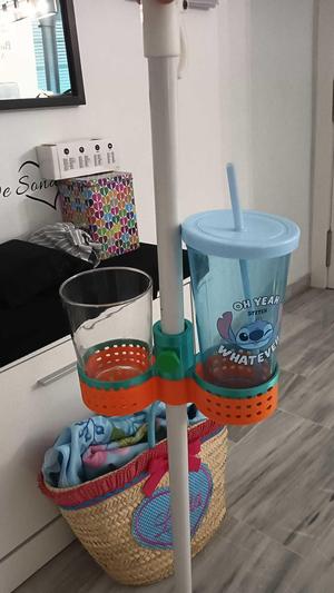 poses umbrella glasses for beach