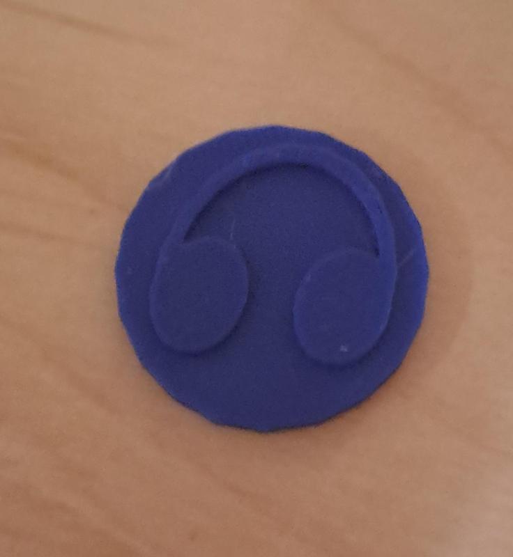 Münze mit Kopfhörer