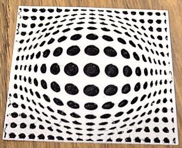 Optical Illusion - black dots in a shape of a drop