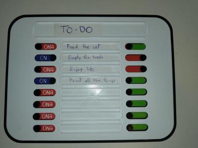 Household task planner with paper label slots