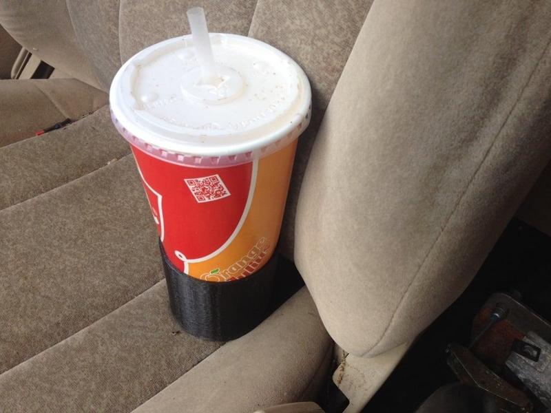 Passenger seat cup holder