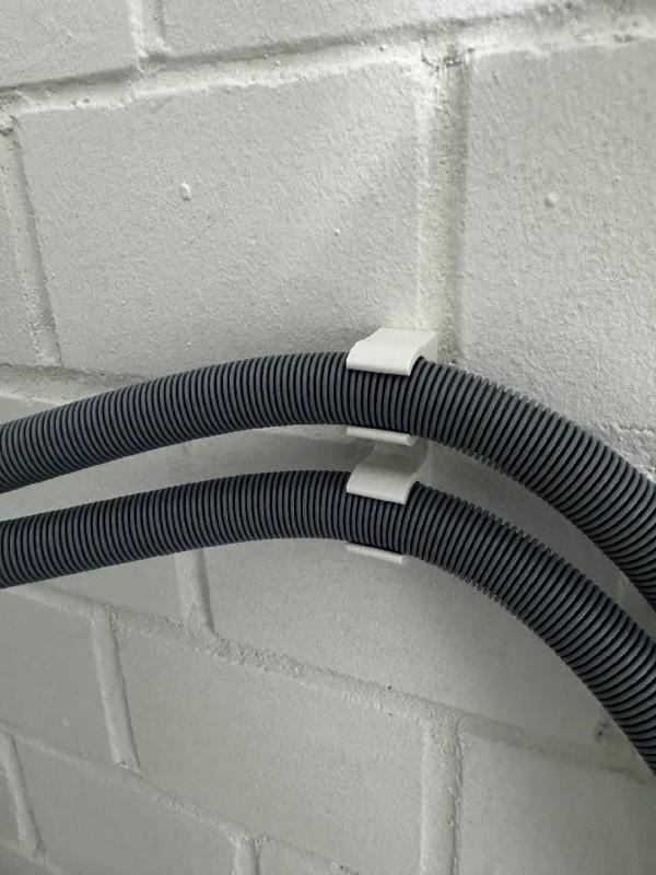 Waschmaschinen Schlauchhalter   