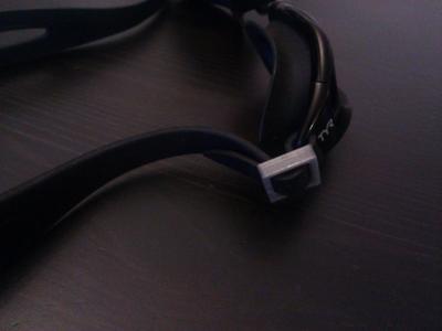 Tightening clip for swimming goggles