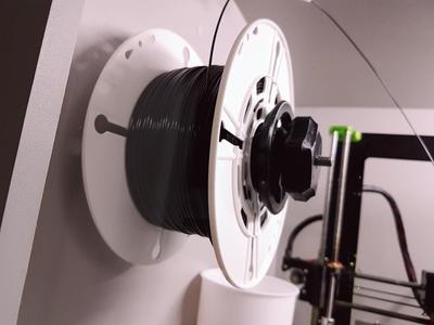 SPOOL HOLDER FOR ENCLAUSUREMENT