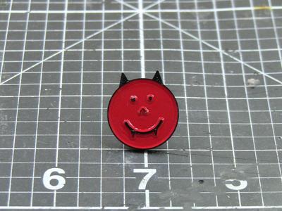 Happy demon head enamel pin