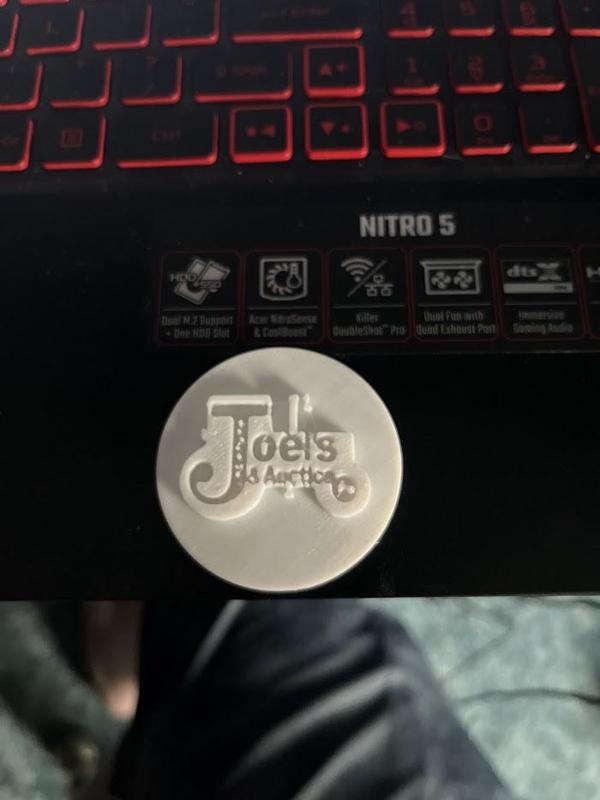 Joel's Tractors logo coin
