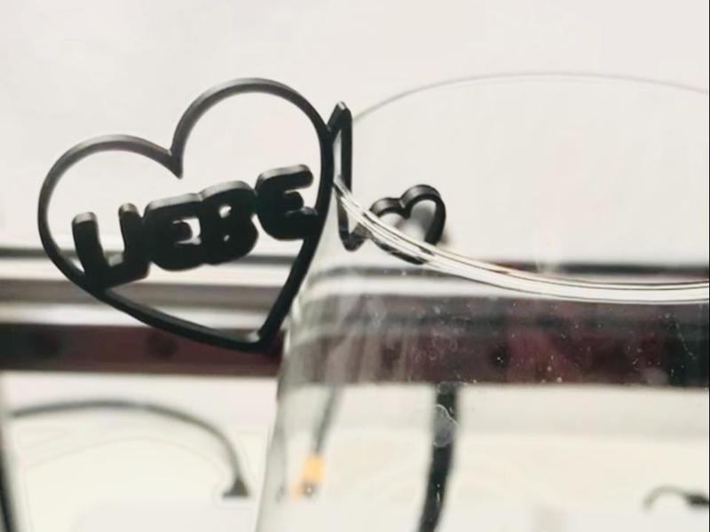 Glass charms with the word Love