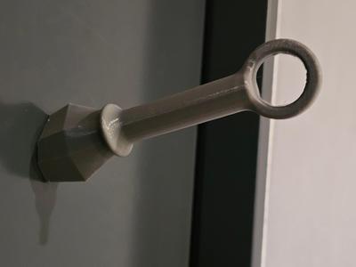 Kunai knife magnet stabbed into the fridge