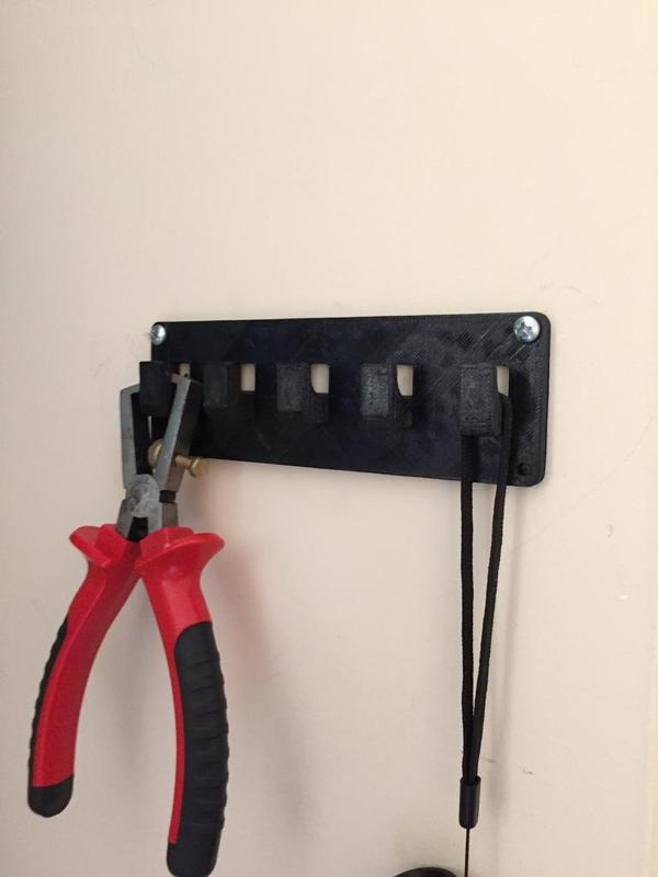 Small wall hanger for cables etc.