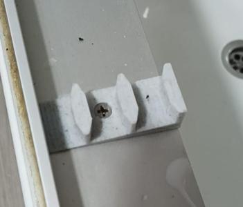 Sliding shower door guide