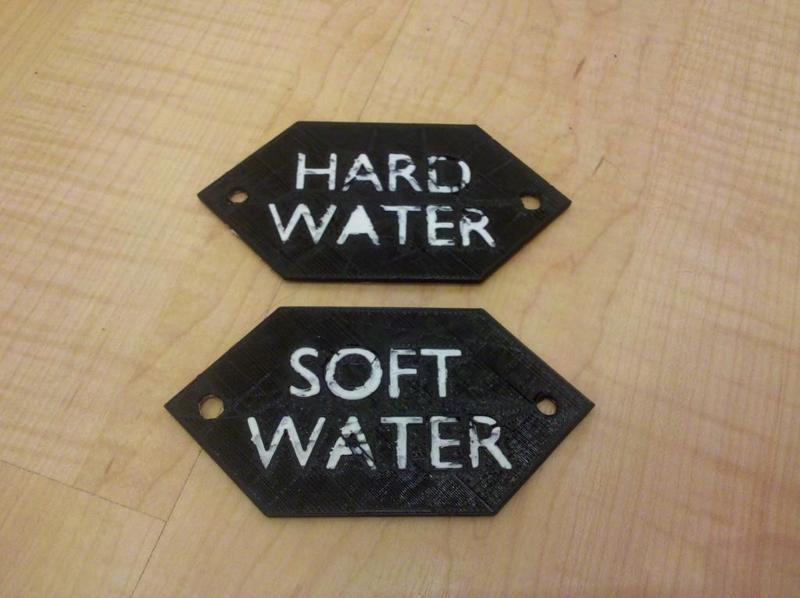 Signs to label hard and soft water taps