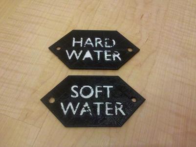 Signs to label hard and soft water taps