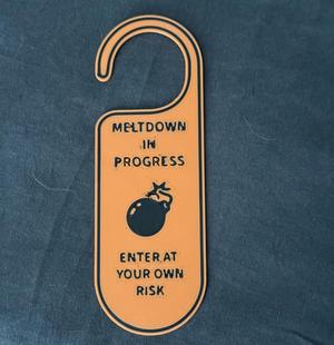 Meltdown in Progress Door Hanger