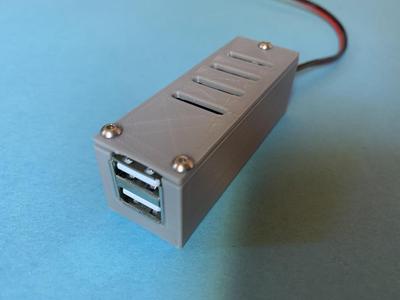 Housing for a DC/DC converter for USB