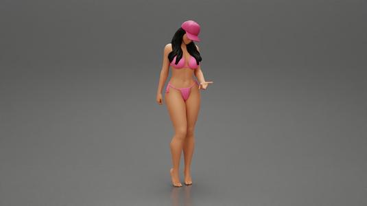 Young Beautiful Girl Wearing Bikini and Hat putting her hand on friend s face