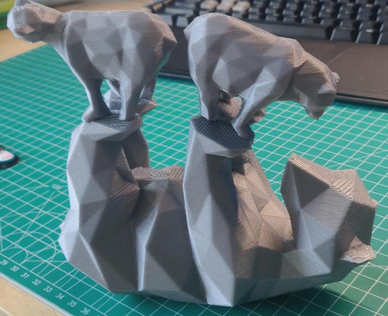 Bears holding up small bears