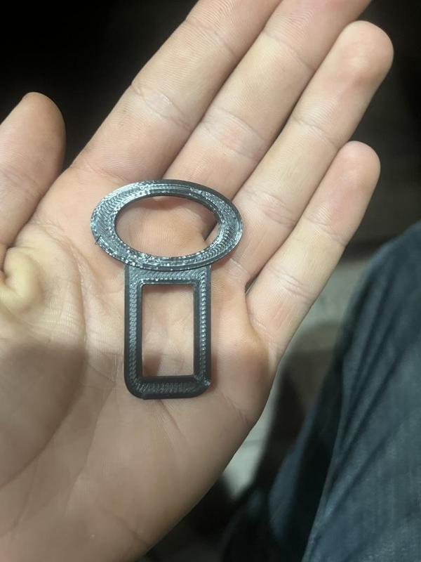 Seatbelt dinger stopper