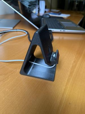 Phone Stand with Captive Charge Cable.