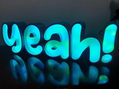 Minimalist LED Sign Box with the phrase YEAH!