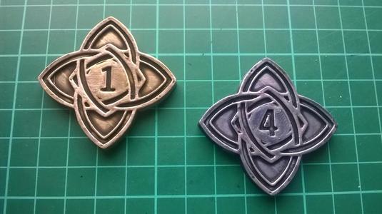 Numenera XP token, 1 and 4