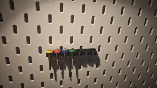 Holder for Revo nozzles for IKEA Skadis
