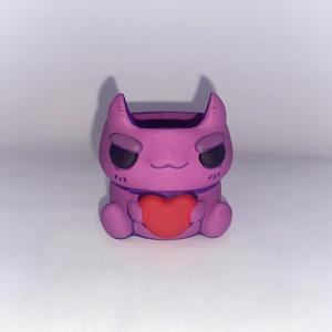 Pot with cuddly monsters
