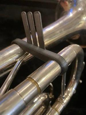 Folding trumpet mounted music stand