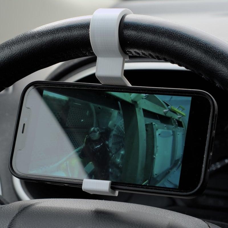 Steering wheel phone holder