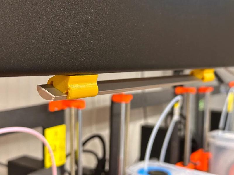 Angled clip holder for under cabinet lights   