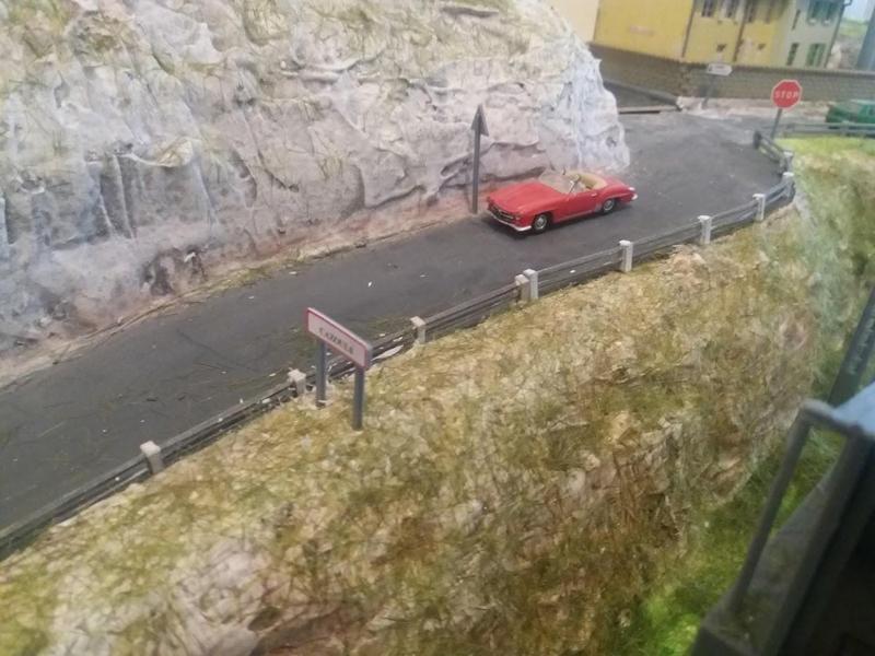 Metal and concrete curb and guardrail