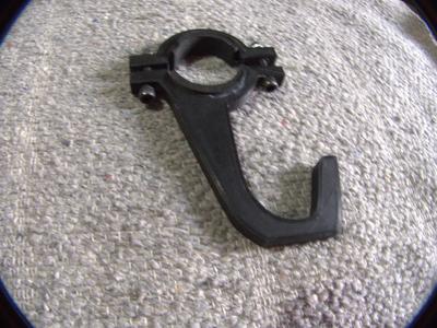 Hook to hang steering wheel to roll cage