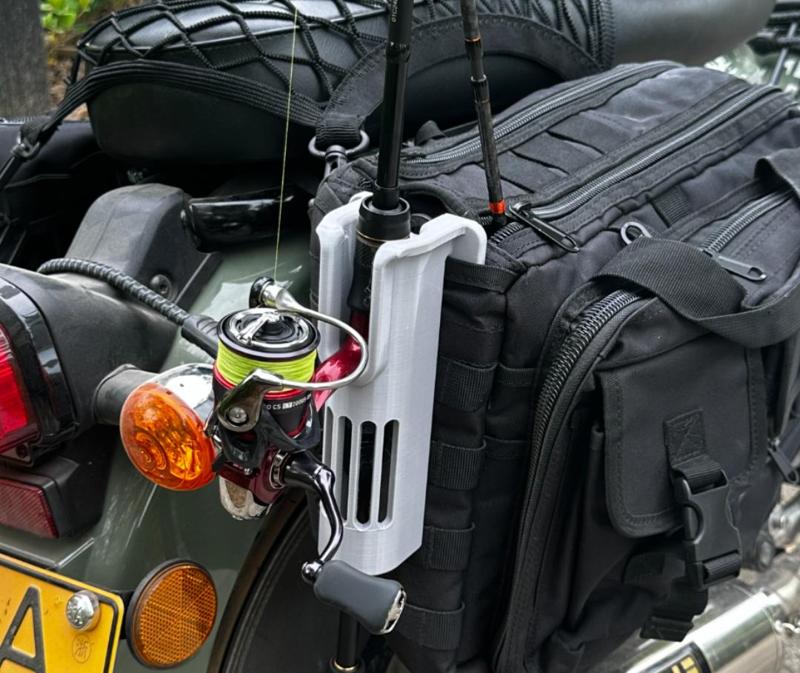 Universal fishing rod holder that can be clipped or worn with a strap