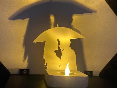 Couple under umbrella shadow