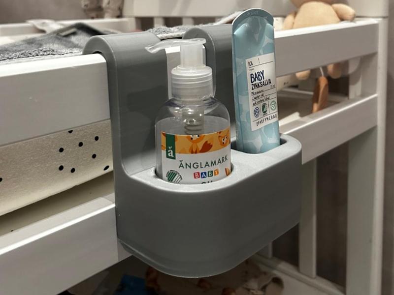 Babyoil holder for changing table