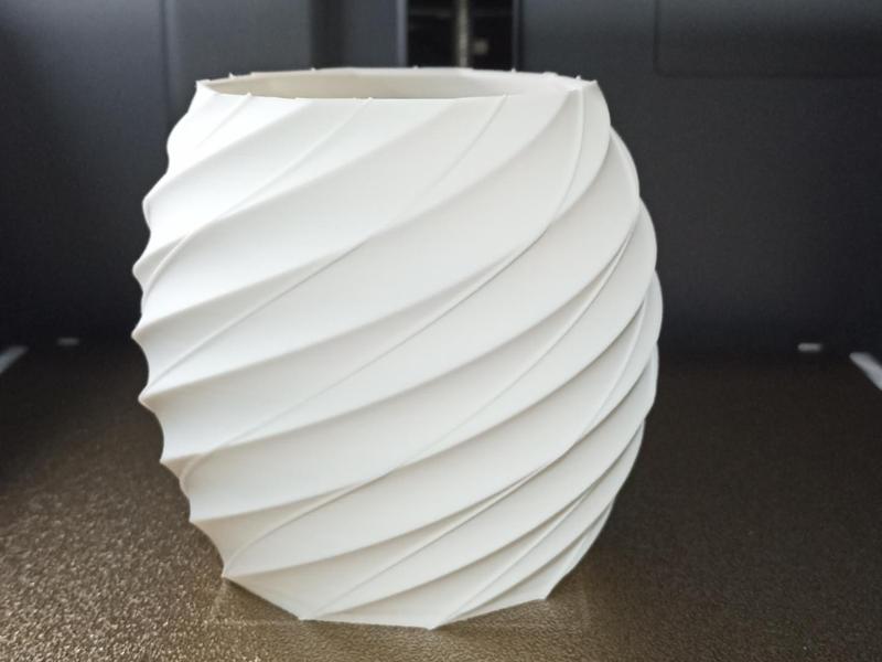 Toothbrush holder and mini flower pot.