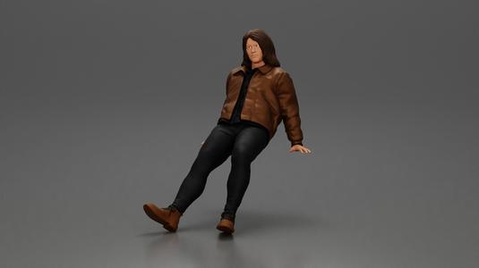 Man with long hair wearing brown jacket sitting with relaxed posture