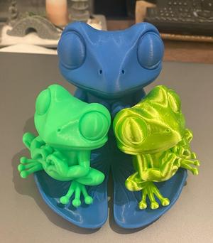 Cute hands-in-the-heart frog